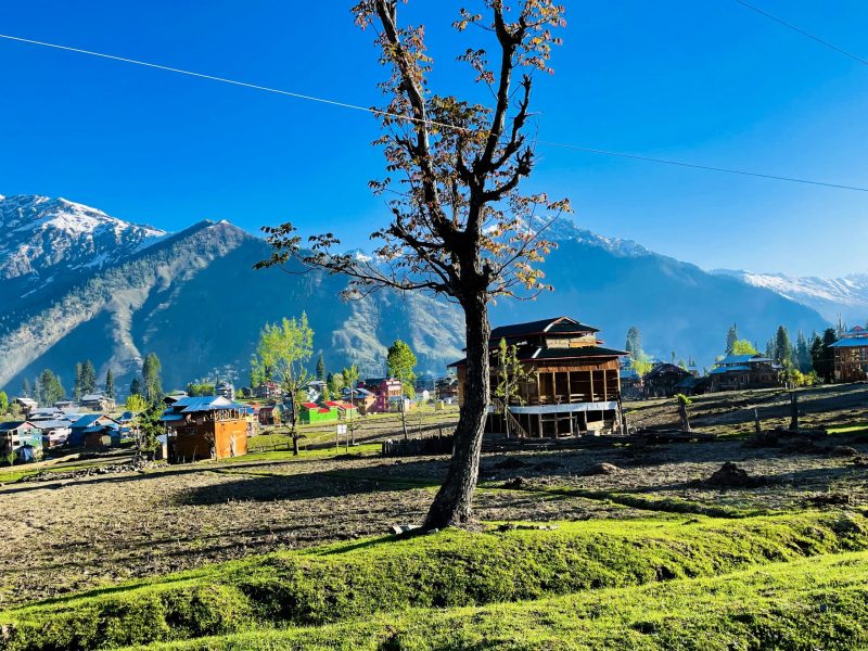 beautiful-landscape-arang-kel-kashmir-with-green-fields-local-houses-with-hidden-clouds
